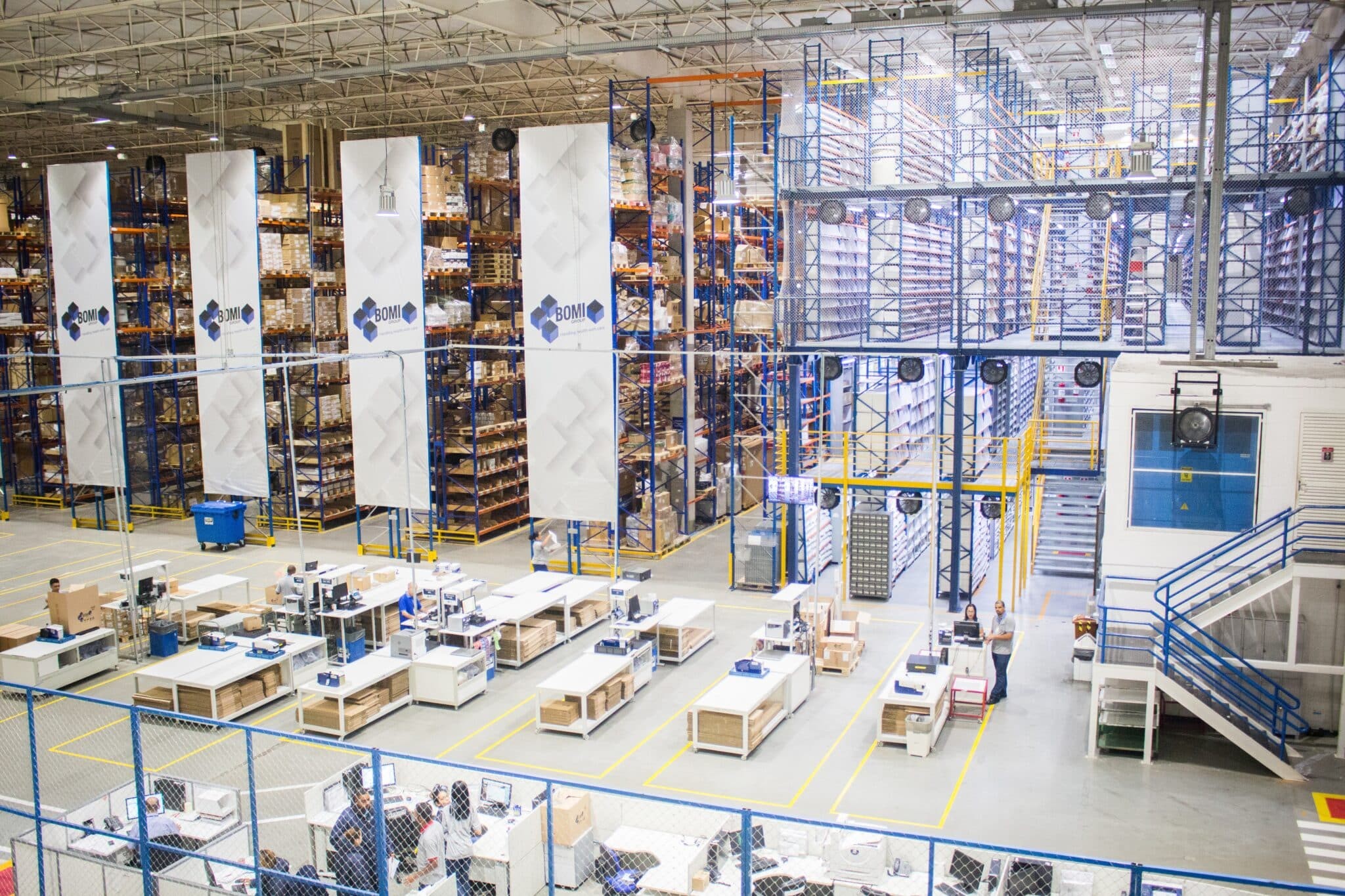 Warehouse racking and packing stations inside SKU Distribution's Foreign Trade Zone facility in Mesa, Arizona
